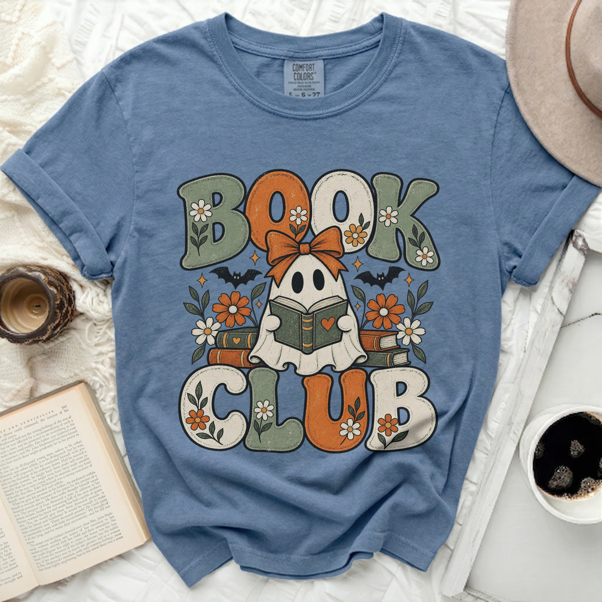 Blue shirt with "Book Club" graphic featuring a ghost reading.