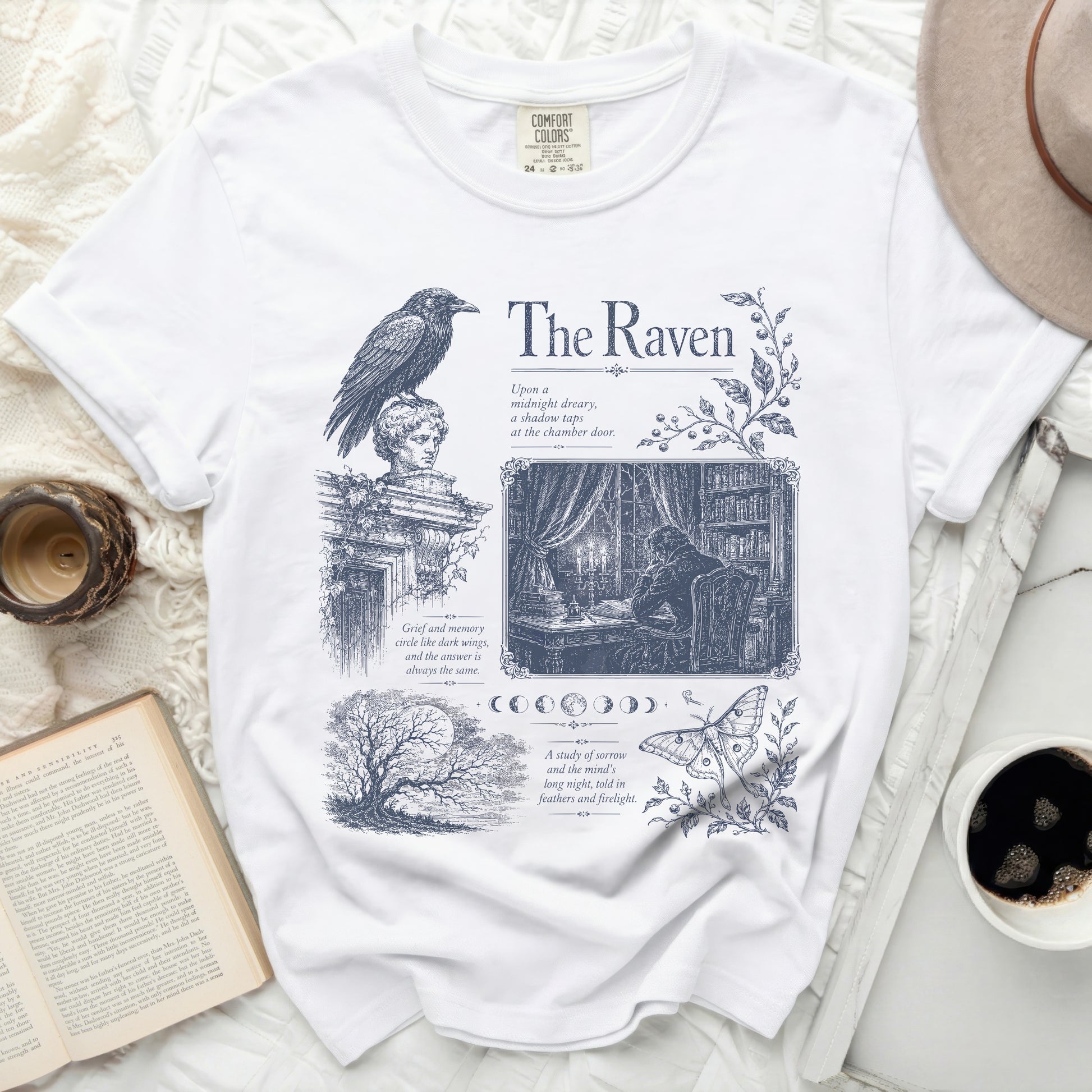 White t-shirt with navy blue raven, text, and illustrations from "The Raven".