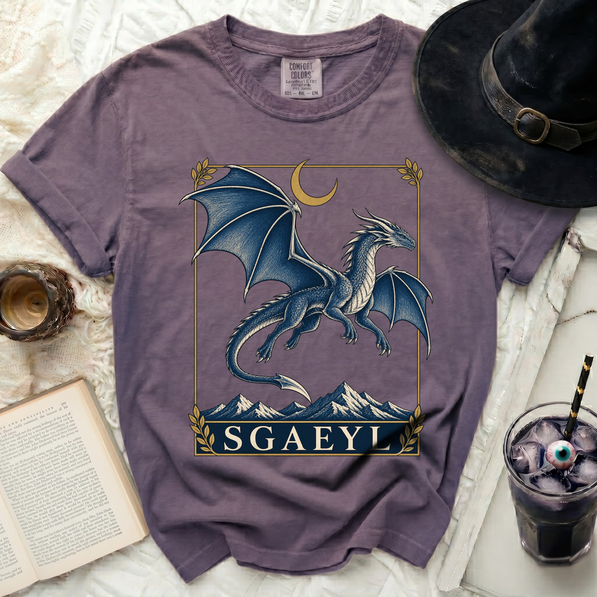 Purple t-shirt with a blue dragon design and the text "SGAEYL"