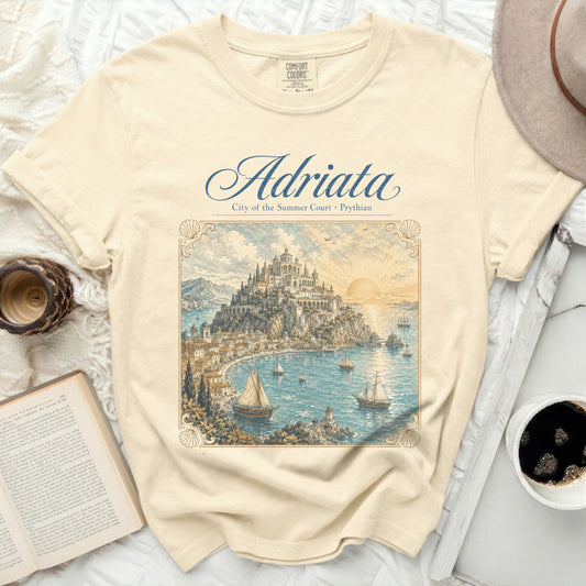 Cream t-shirt with "Adriata City of the Summer Court Prythian" and a coastal city illustration.
