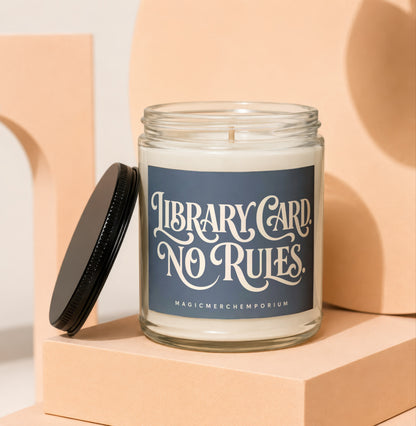 Jar candle with navy label that reads "Library Card. No Rules."