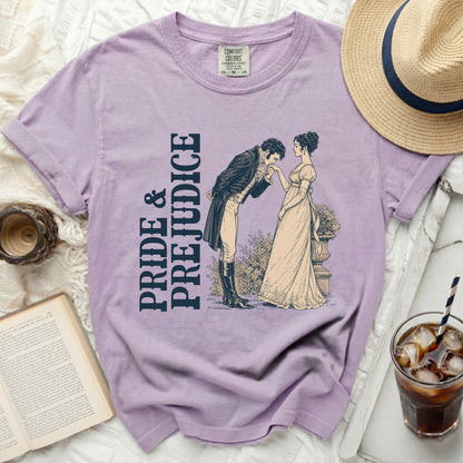 Lavender t-shirt with "Pride & Prejudice" text and illustration of a couple.
