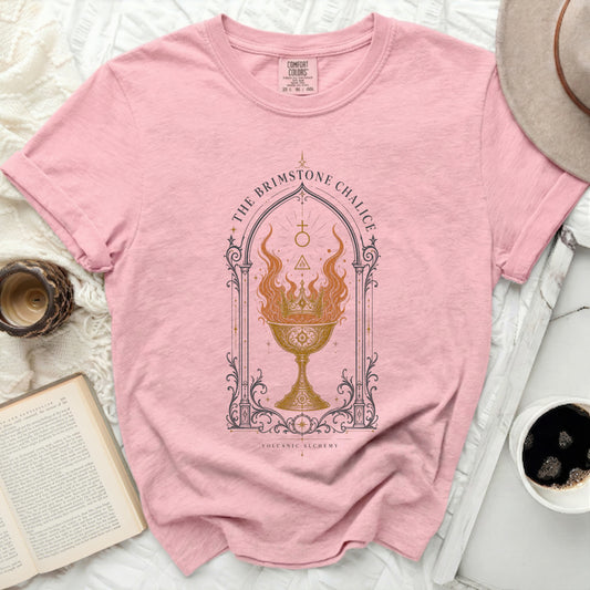 Pink t-shirt with "The Brimstone Chalice" graphic and "Volcanic Alchemy" text.