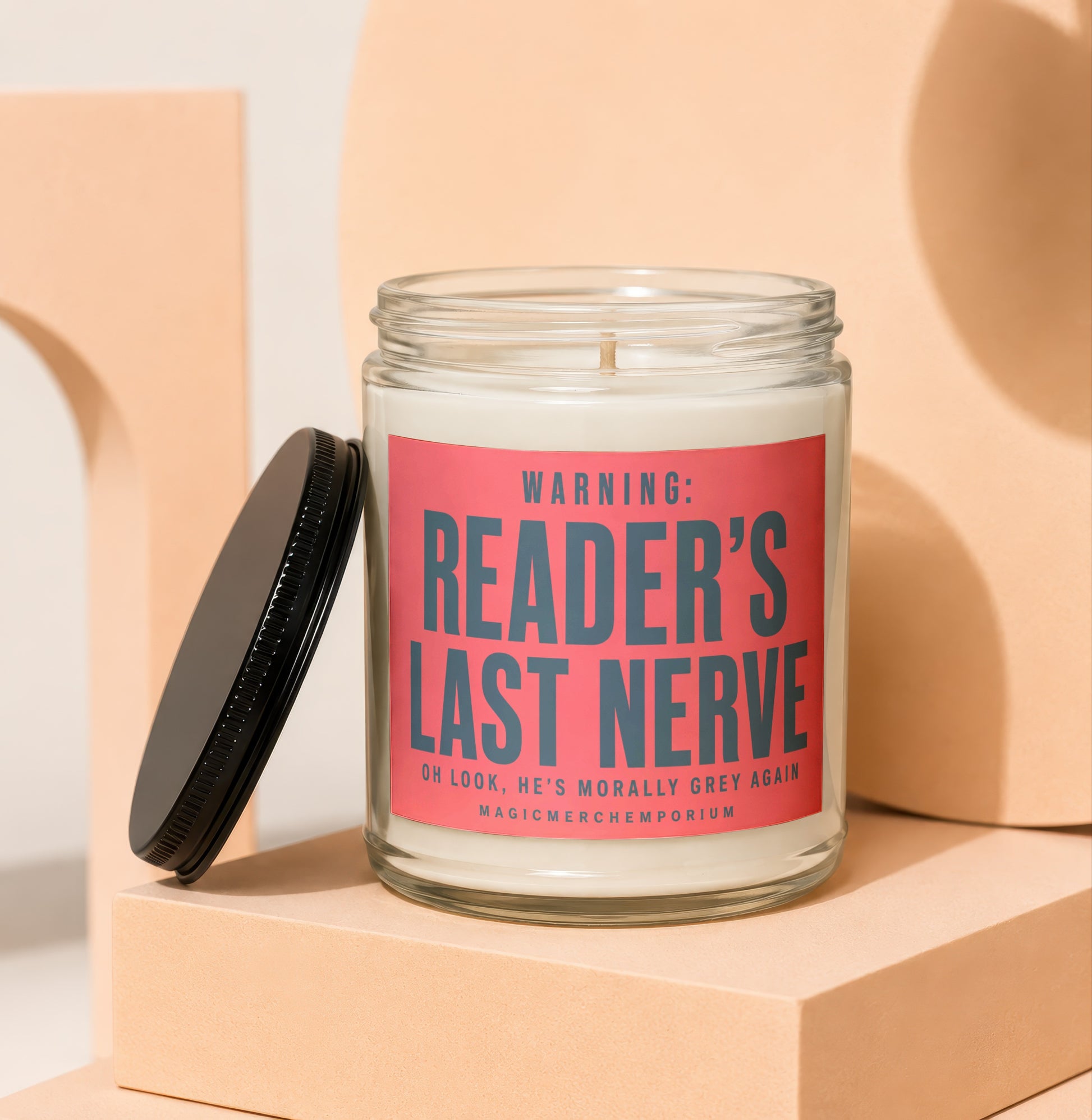 Glass candle with red label reading "WARNING: READER'S LAST NERVE"