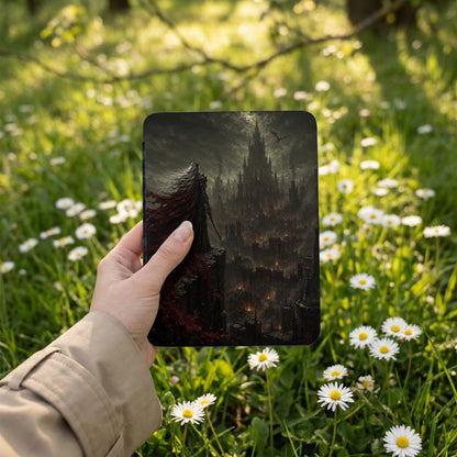 Dark fantasy artwork on a device held in a hand, featuring a figure with a red cloak overlooking a dark castle.