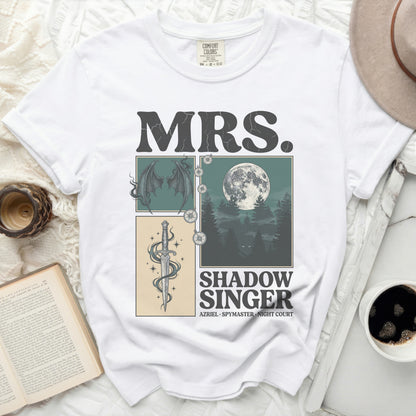 White t-shirt with "MRS. SHADOW SINGER" text and moonlit dragon art.