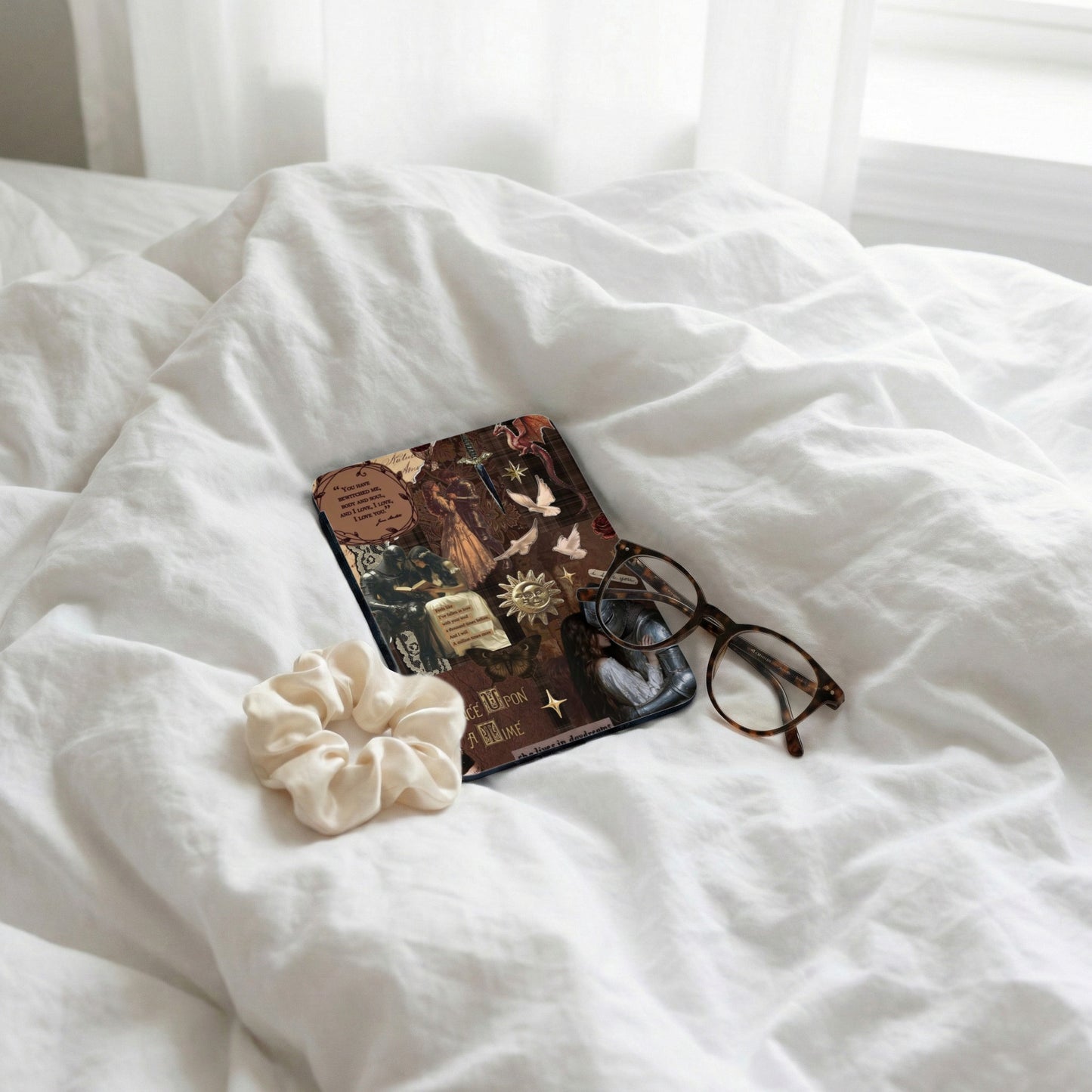 Collage on phone case with knights, birds, and text, with glasses and scrunchie.