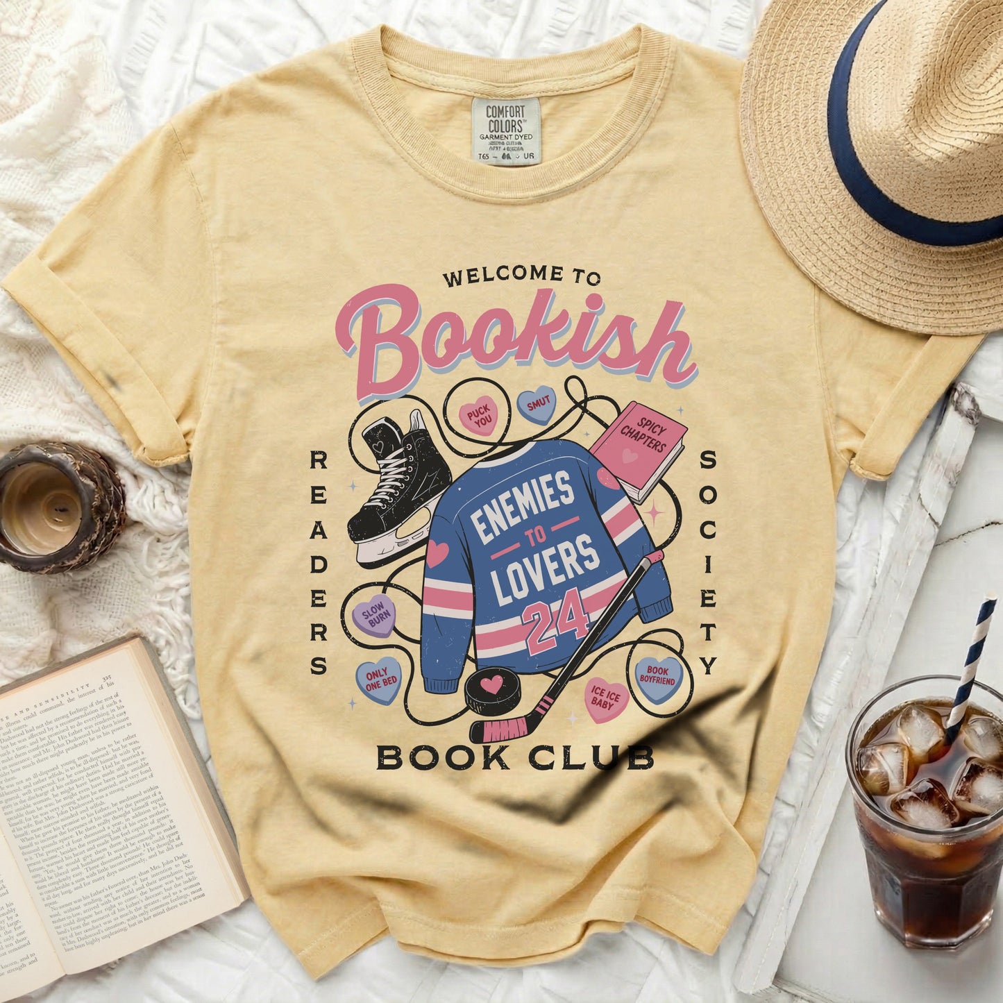 Yellow t-shirt with "Bookish Enemies to Lovers Book Club" graphic.