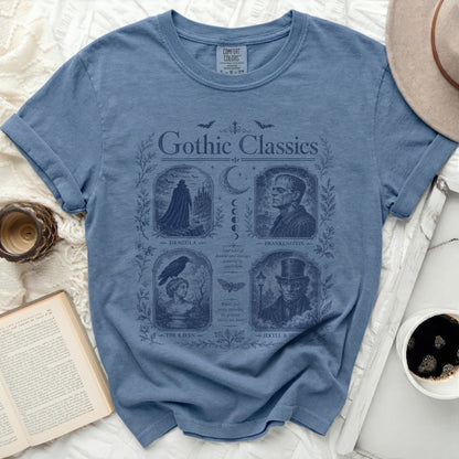 Blue t-shirt with "Gothic Classics" print featuring Dracula, Frankenstein, The Raven, and Jekyll & Hyde.