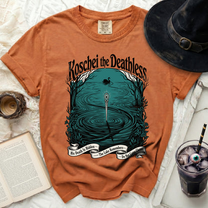 Orange t-shirt with "Koschei the Deathless" artwork and banner text.