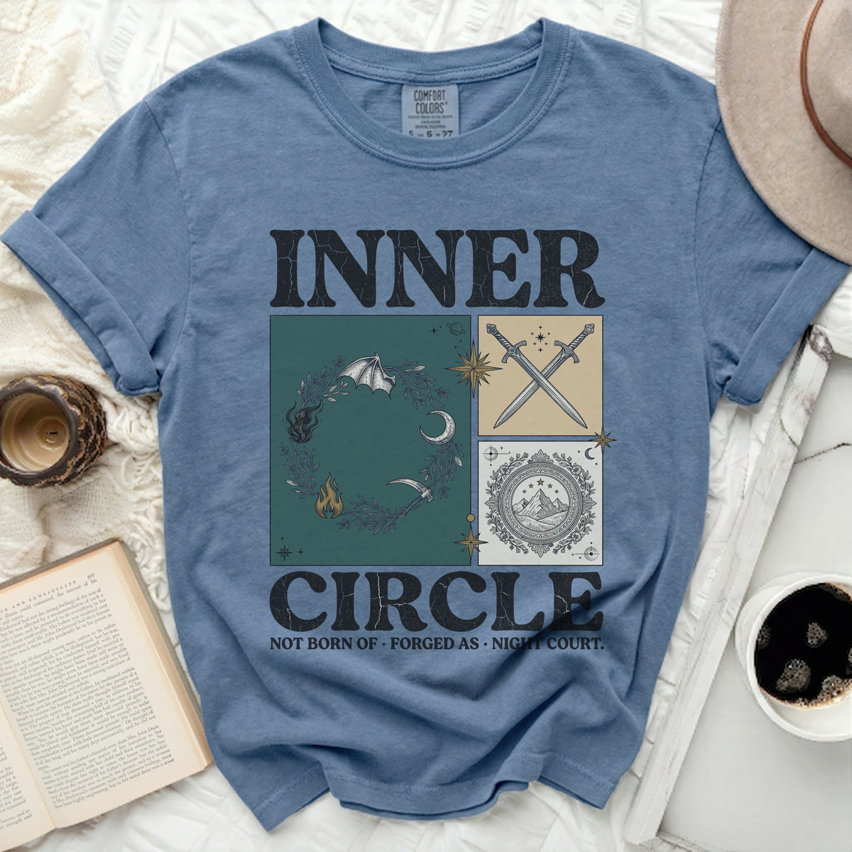 Blue t-shirt with "INNER CIRCLE NOT BORN OF FORGED AS NIGHT COURT." design.