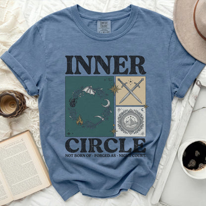 Blue t-shirt with "INNER CIRCLE NOT BORN OF FORGED AS NIGHT COURT." design.