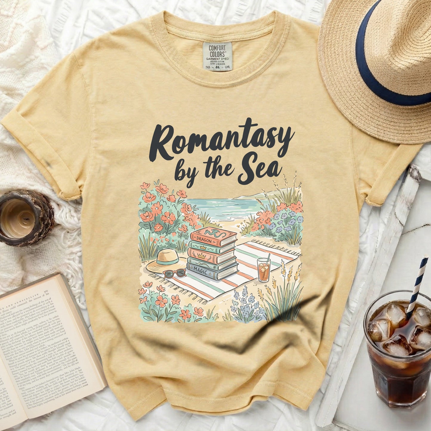 Yellow t-shirt with "Romantasy by the Sea" text and book stack graphic.