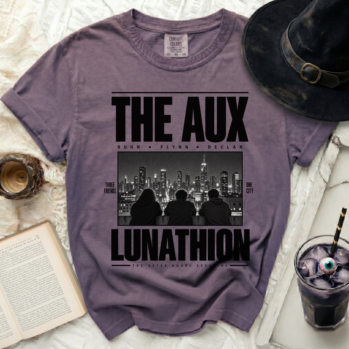 The Aux Lunathion t-shirt with graphic of three friends and city skyline.