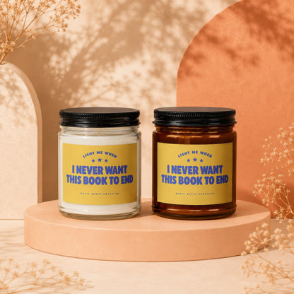 Two scented candles with yellow labels reading "I Never Want This Book To End".