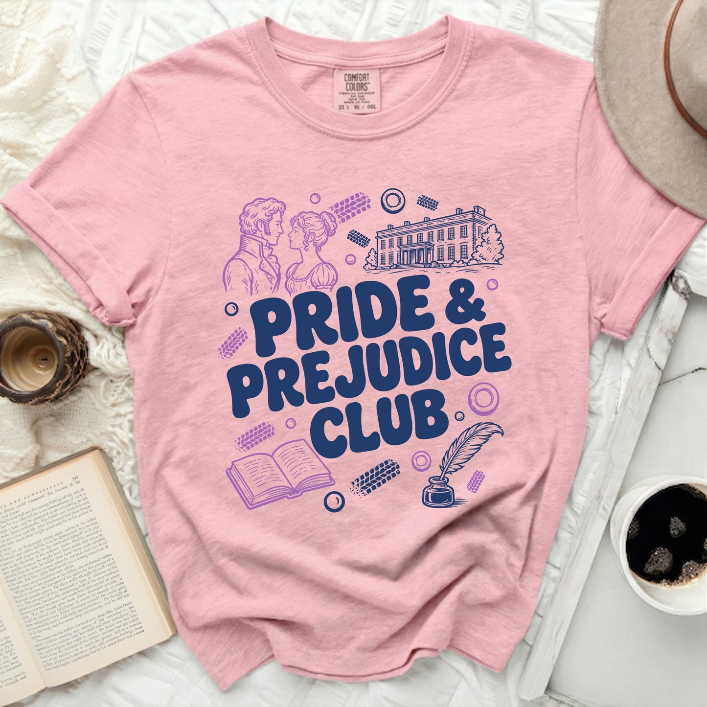 Pink t-shirt with "Pride & Prejudice Club" text and literary illustrations.