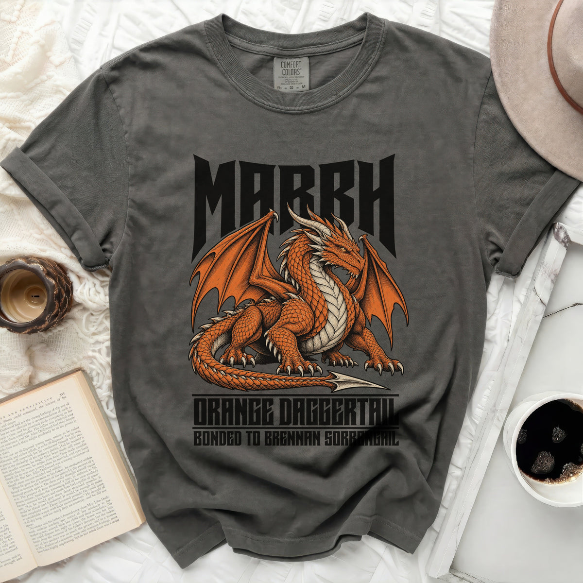 Dark gray t-shirt with orange dragon graphic and text "MARRH ORANGE DAGGERTAIL BONDED TO BRENNAN SORBENGAIL".