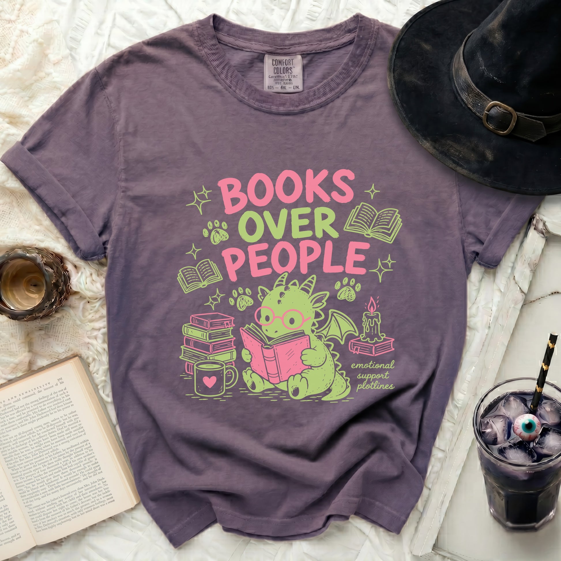 Purple t-shirt with "BOOKS OVER PEOPLE emotional support plotlines" graphic and cute dragon.