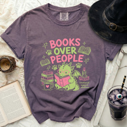 Purple t-shirt with "BOOKS OVER PEOPLE emotional support plotlines" graphic and cute dragon.