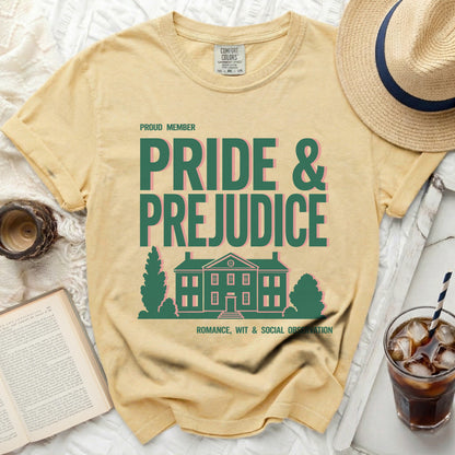 Yellow t-shirt with "Pride & Prejudice" text and a house illustration.