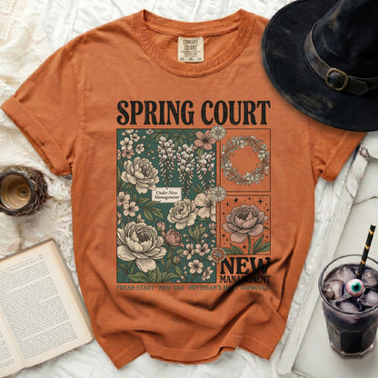 Orange t-shirt with floral graphics and "Spring Court New Management" text.