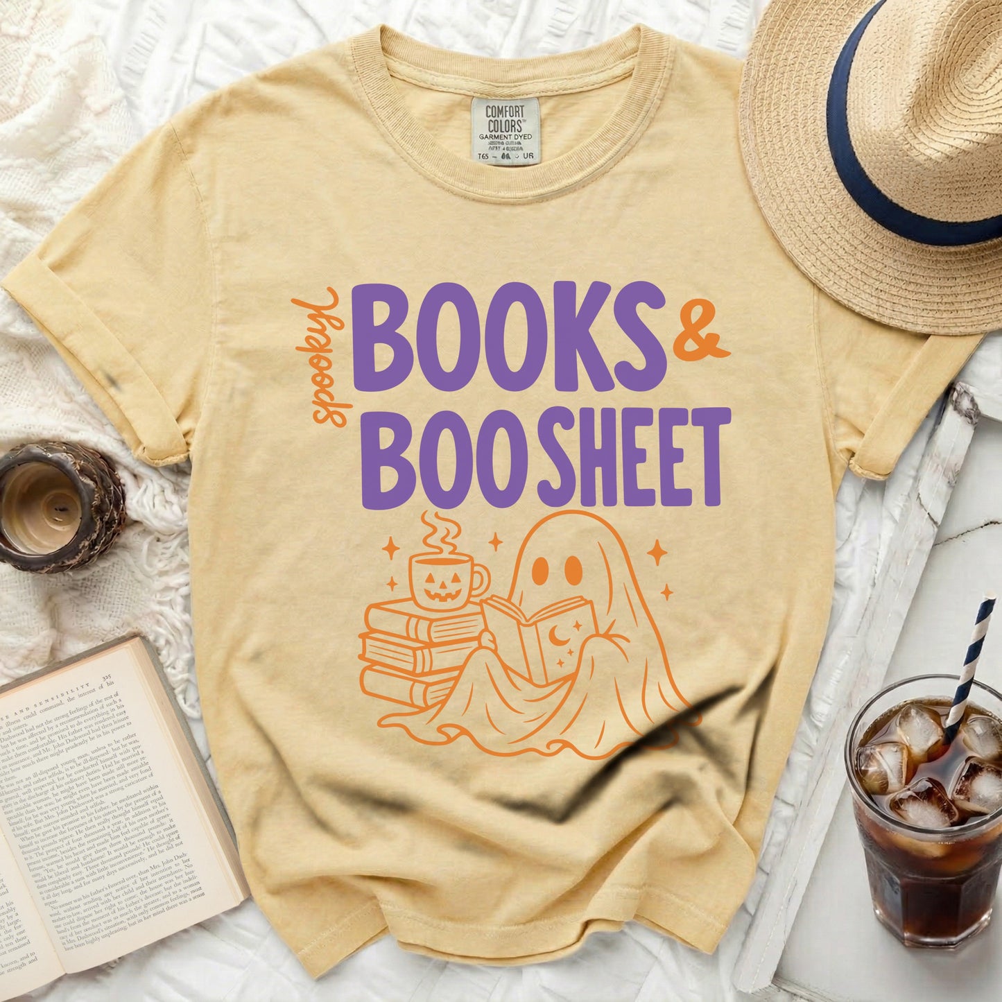 Yellow shirt with "spooky books & boo sheet" and a ghost.