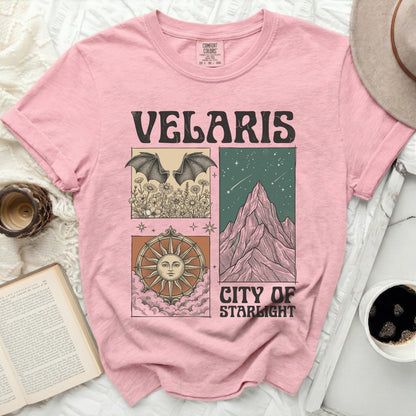 Pink t-shirt with "Velaris City of Starlight" text and square graphic designs.