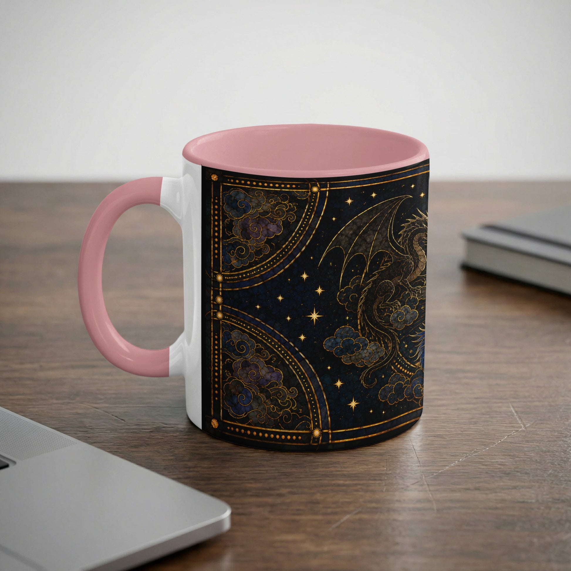 White mug with pink handle features a dark blue dragon and clouds design.