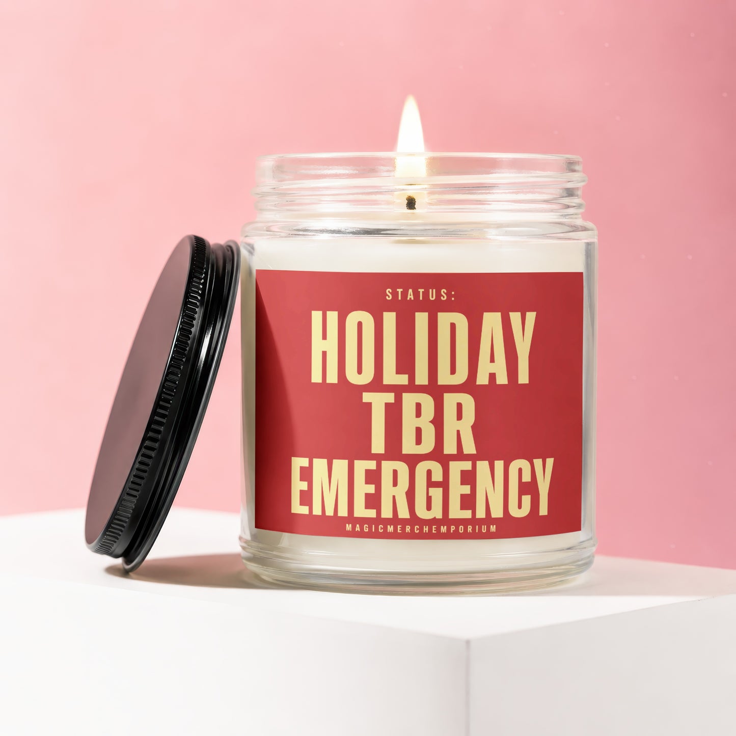 Candle with label "Status: Holiday TBR Emergency" in a jar.
