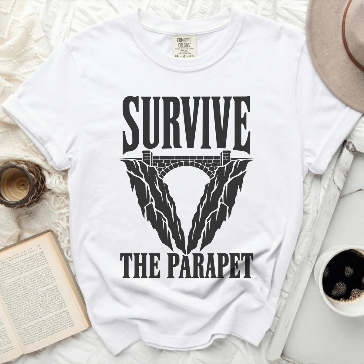 White t-shirt with "SURVIVE THE PARAPET" text and bridge graphic.