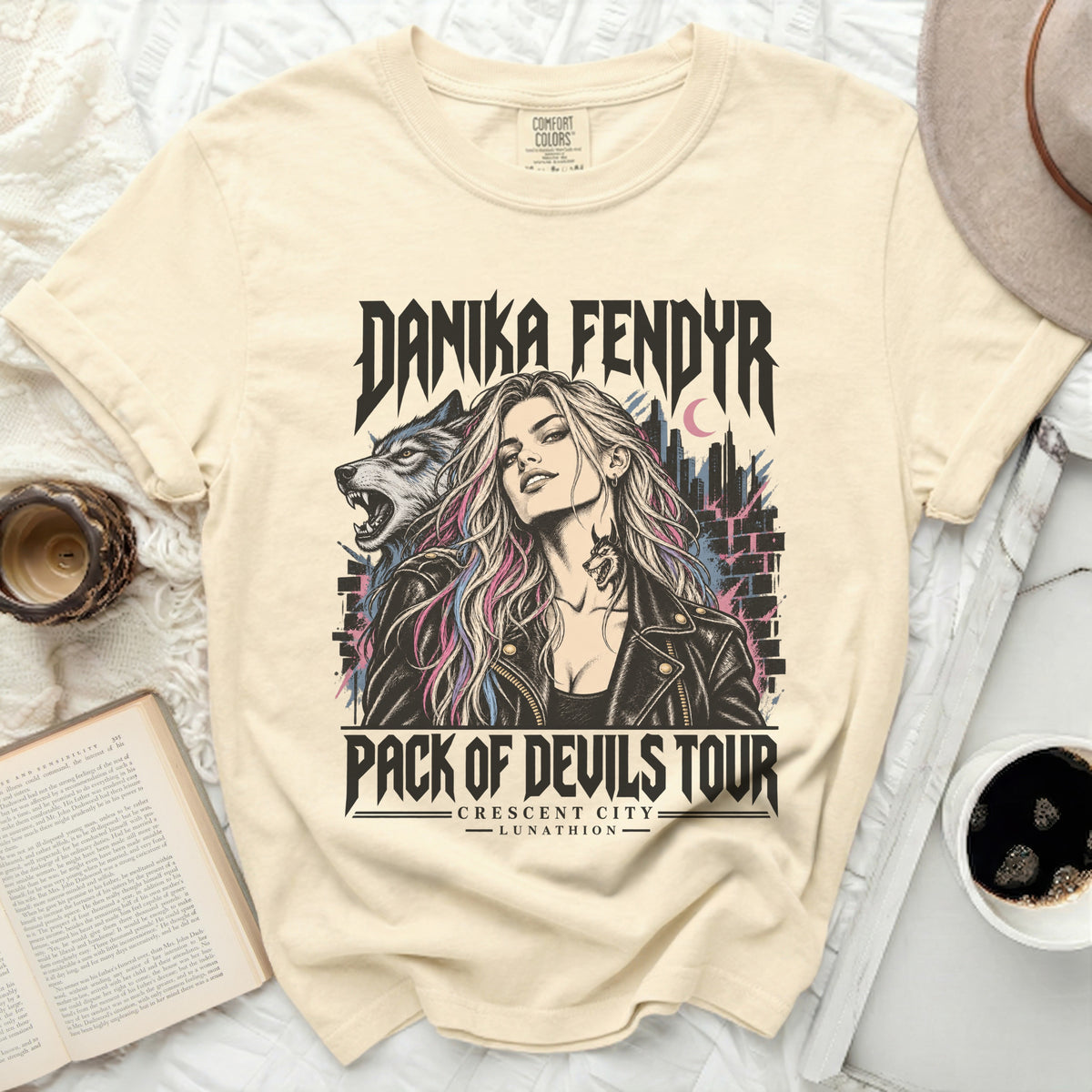 Danika Fendyr Pack of Devils Tour t-shirt with wolf and city graphic.