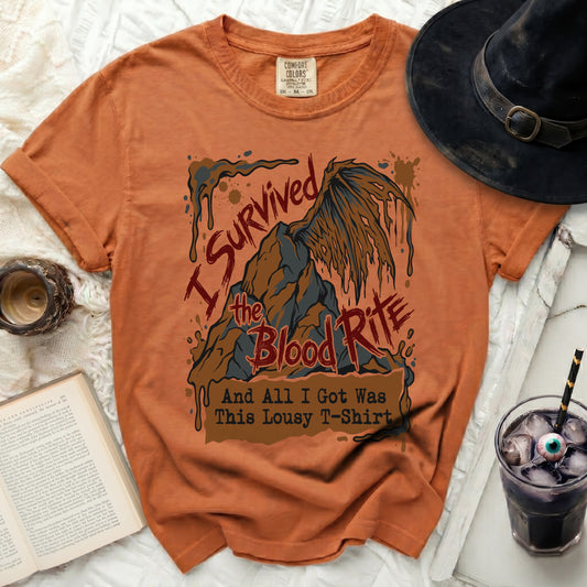 Orange t-shirt with "I Survived the Blood Rite And All I Got Was This Lousy T-Shirt" graphic.