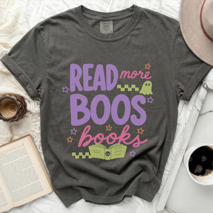 Graphic tee with "Read more Boos books" in purple and pink lettering.