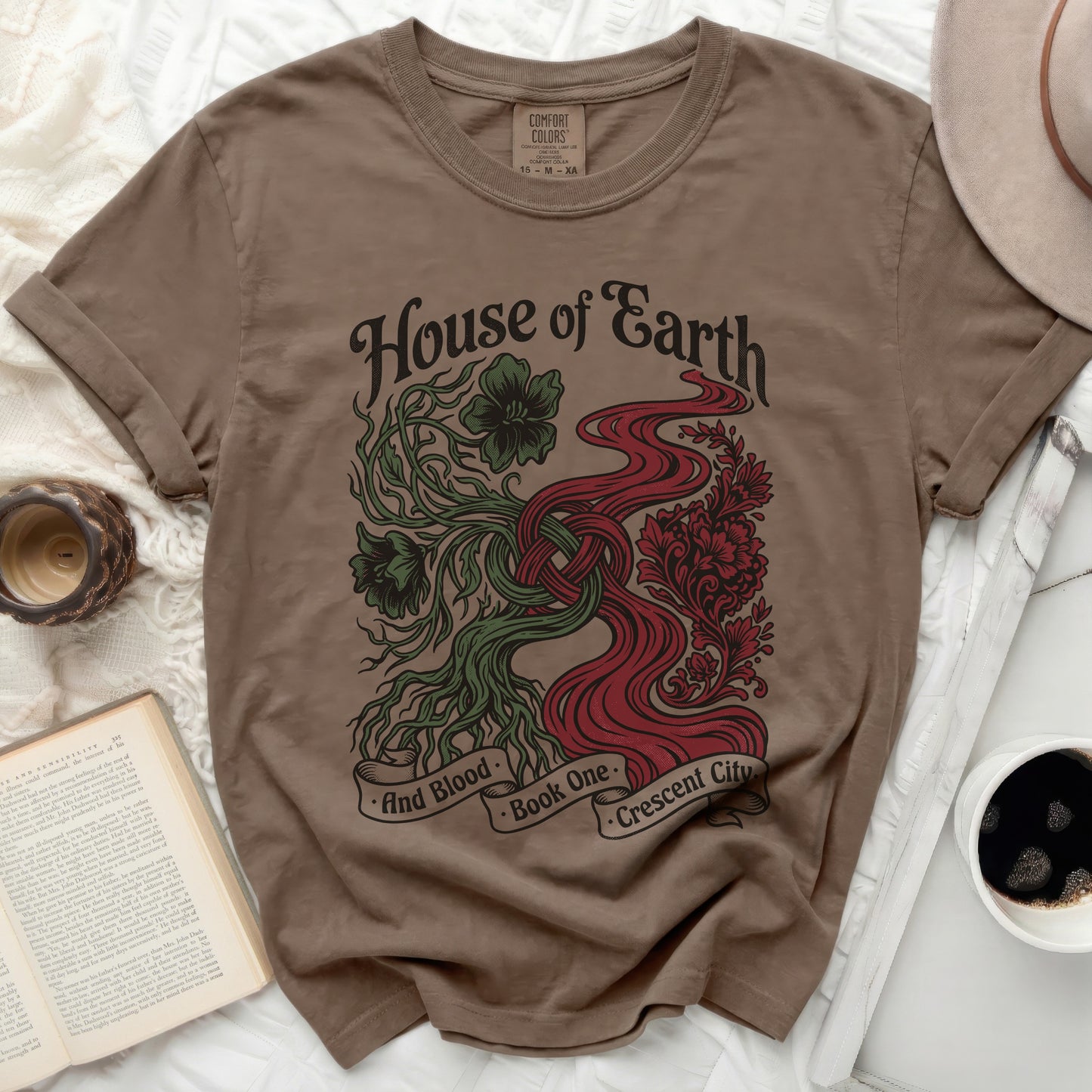 Brown t-shirt with "House of Earth and Blood Book One Crescent City" graphic.