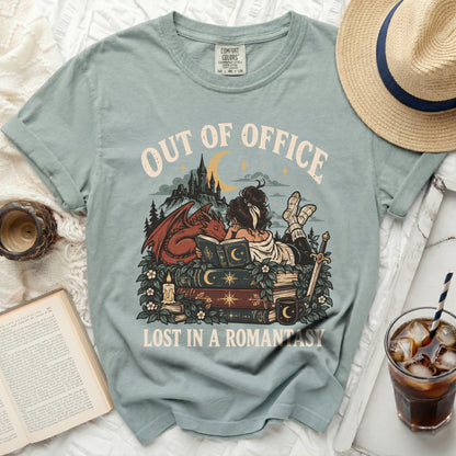 Out of Office Lost in a Romantasy t-shirt with dragon and castle graphic.