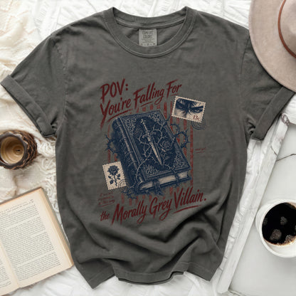 Dark grey t-shirt with a book, thorns, and text: "POV: You're Falling For the Morally Grey Villain."