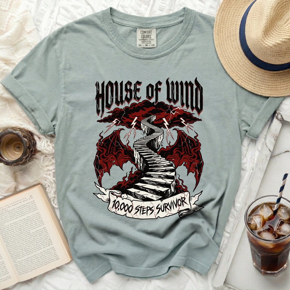T-shirt with "House of Wind 10,000 Steps Survivor" graphic.