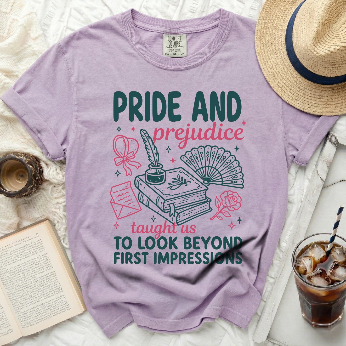 Lavender t-shirt with "Pride and Prejudice" design and literary elements.