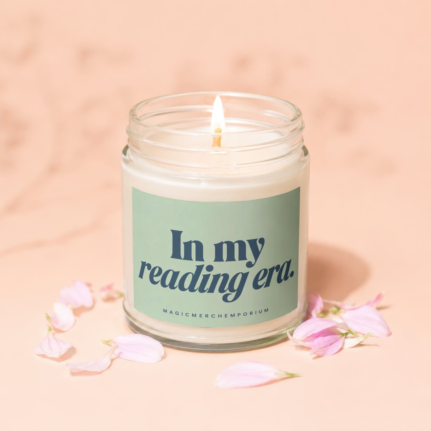 Lit candle in a jar with "In my reading era." text and petals.