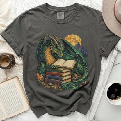 Green dragon reading a book on a stack of books under a full moon.