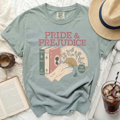 T-shirt with "Pride & Prejudice" text, books, fan, and gloves graphic.