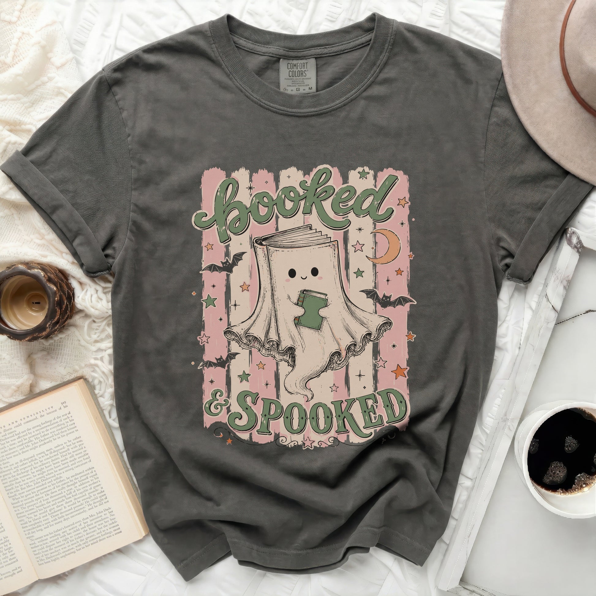 Shirt with ghost reading a book and text "booked & SPOOKED".
