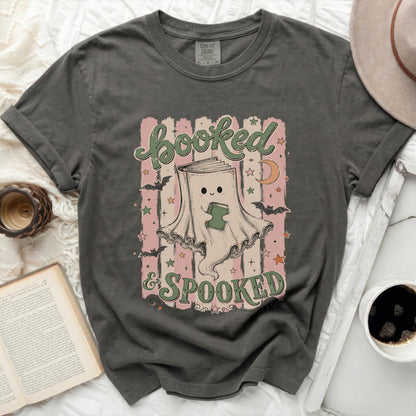 Shirt with ghost reading a book and text "booked & SPOOKED".