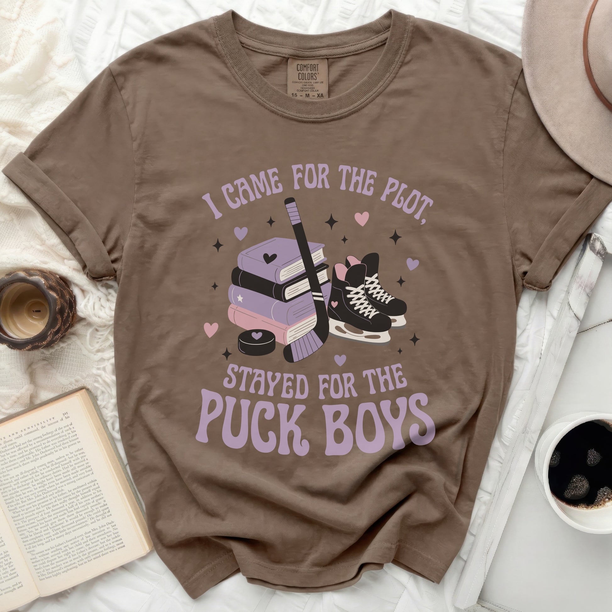 Brown t-shirt with "I Came for the Plot, Stayed for the Puck Boys" text and hockey graphics.