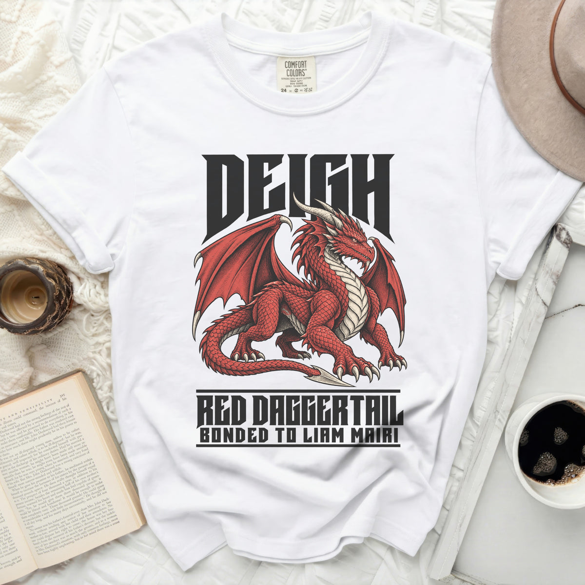 White t-shirt with a red dragon design and text "DEIGH RED DAGGERTAIL BONDED TO LIAM MAIRI".