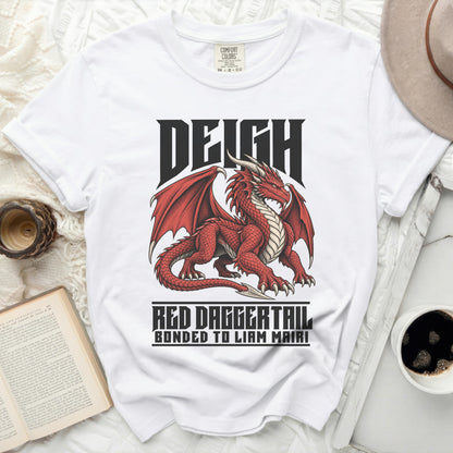 White t-shirt with a red dragon design and text "DEIGH RED DAGGERTAIL BONDED TO LIAM MAIRI".