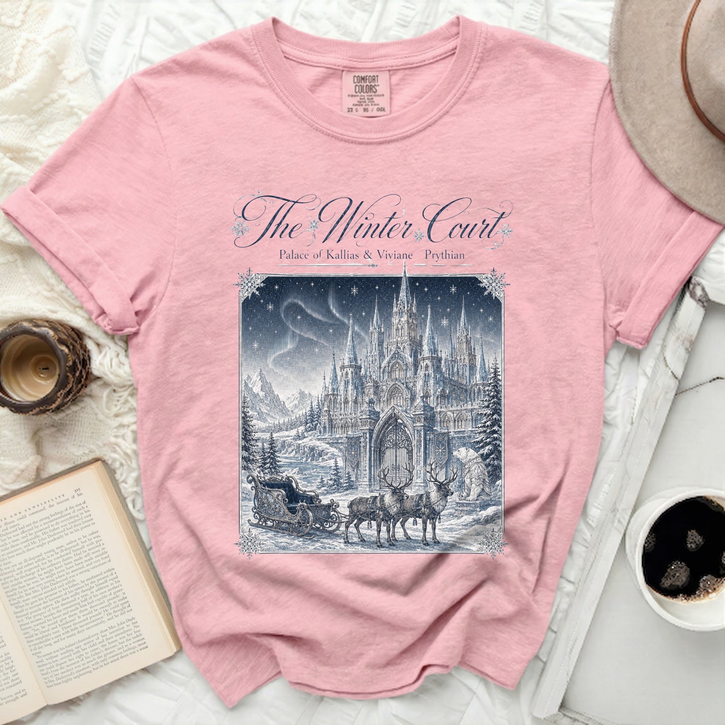 Pink t-shirt with "The Winter Court Palace of Kallias & Viviane Prythian" graphic.