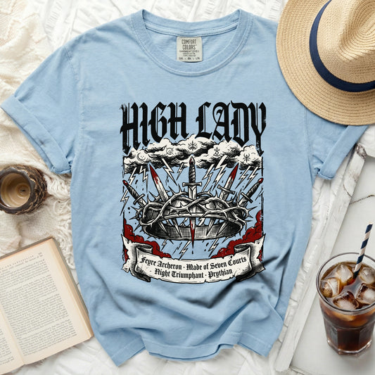 Light blue t-shirt with "High Lady" text, crown, swords, and banner.