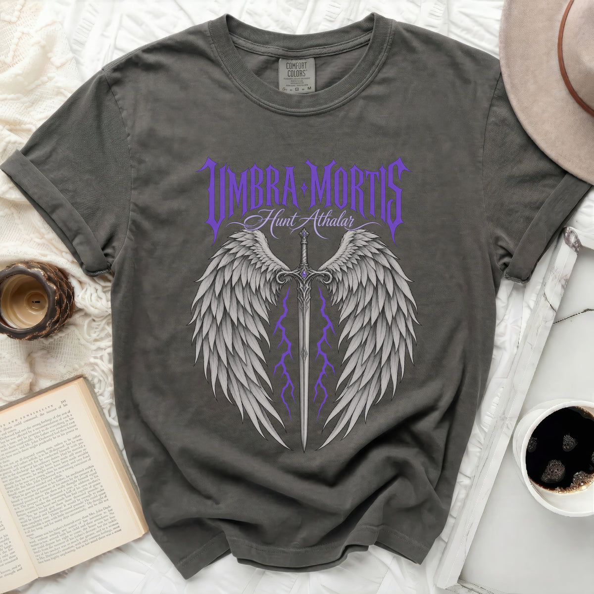 Dark grey t-shirt with purple "Umbra Mortis Hunt Athalar" text and winged sword design.