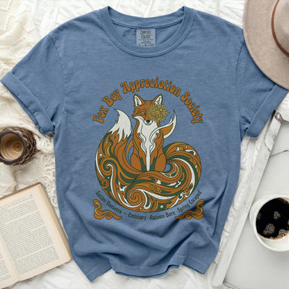 Blue t-shirt with a graphic of a fox and "Fox Boy Appreciation Society" text.